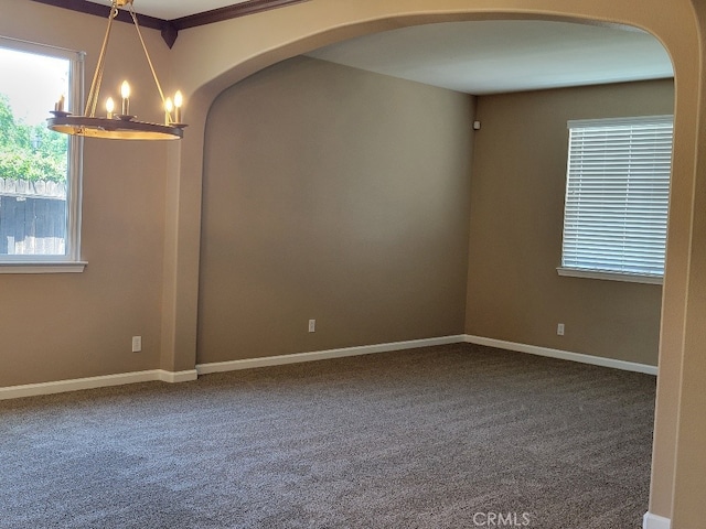 511 Milano Ct, Los Banos, CA 93635 - carpeted spare room featuring a chandelier and arched walkways