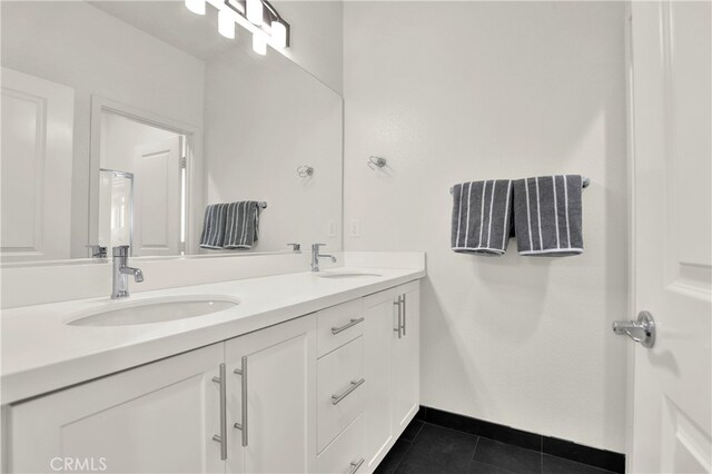 7 Abarrota St, Rancho Mission Viejo, CA 92694 - full bathroom featuring tile patterned floors, double vanity, and baseboards