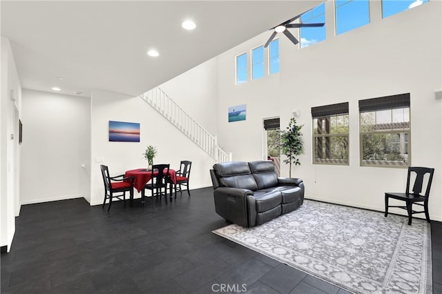 7 Abarrota St, Rancho Mission Viejo, CA 92694 - living area with stairway, recessed lighting, baseboards, a towering ceiling, and ceiling fan