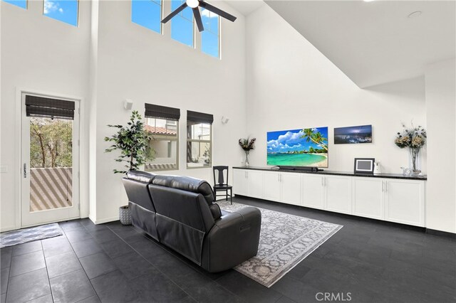 7 Abarrota St, Rancho Mission Viejo, CA 92694 - living room with a high ceiling, a ceiling fan, and baseboards