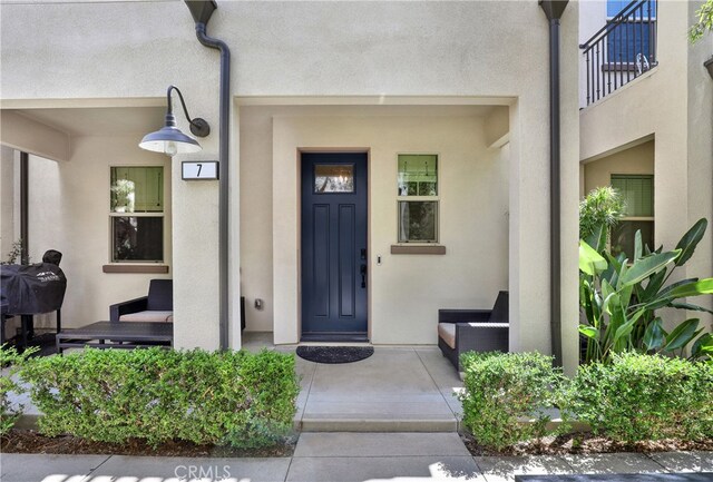 7 Abarrota St, Rancho Mission Viejo, CA 92694 - property entrance featuring stucco siding and a porch