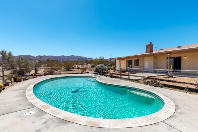 6425 Indian Cove Rd Unit 29, Palms, CA 92277 - view of pool with a mountain view and a patio