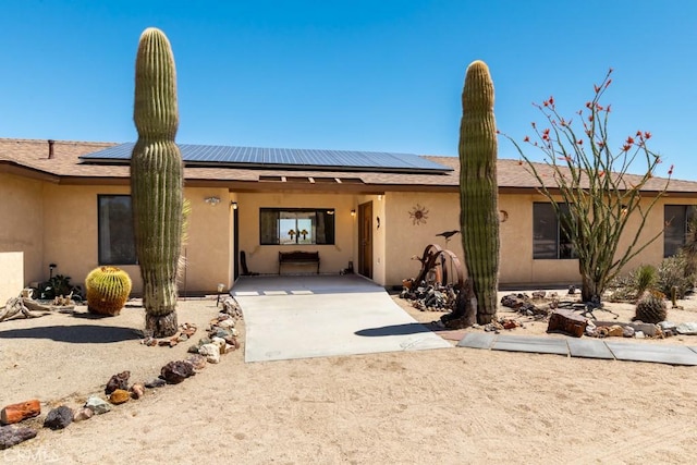 6425 Indian Cove Rd Unit 29, Palms, CA 92277 - ranch-style home with stucco siding and solar panels