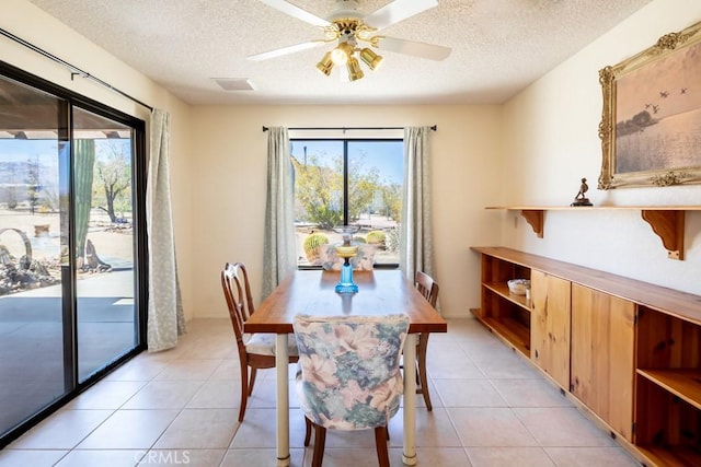 6425 Indian Cove Rd Unit 29, Palms, CA 92277 - dining room with a textured ceiling, ceiling fan, and light tile patterned flooring