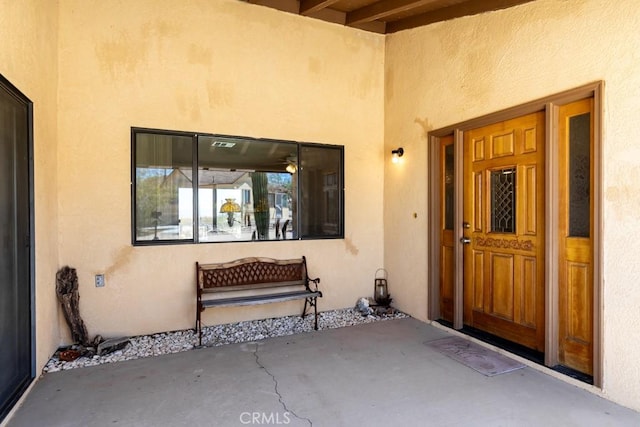 6425 Indian Cove Rd Unit 29, Palms, CA 92277 - doorway to property featuring stucco siding