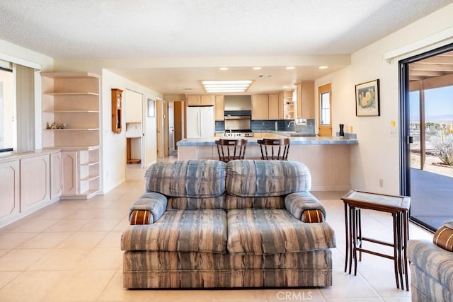 6425 Indian Cove Rd Unit 29, Palms, CA 92277 - living area featuring light tile patterned floors, recessed lighting, and a textured ceiling