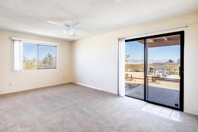 6425 Indian Cove Rd Unit 29, Palms, CA 92277 - empty room with carpet flooring, a ceiling fan, and a textured ceiling