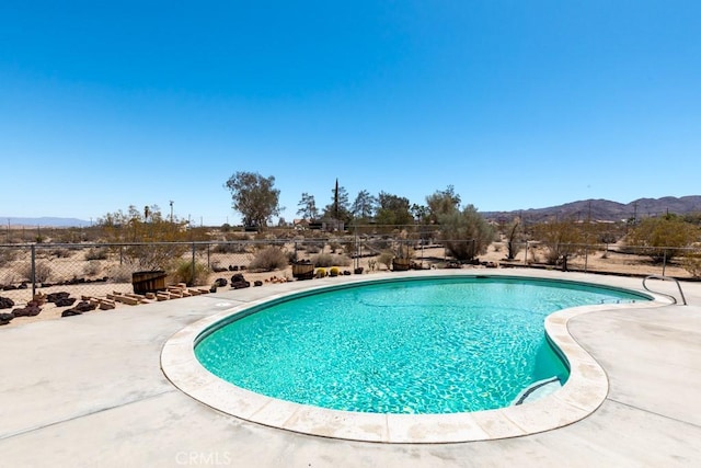 6425 Indian Cove Rd Unit 29, Palms, CA 92277 - view of pool featuring a mountain view
