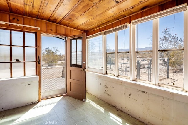 6425 Indian Cove Rd Unit 29, Palms, CA 92277 - unfurnished sunroom featuring wooden ceiling, a mountain view, and tile patterned floors