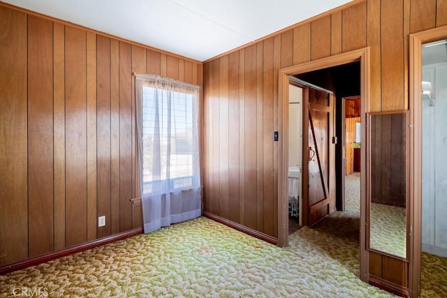 6425 Indian Cove Rd Unit 29, Palms, CA 92277 - carpeted empty room featuring wooden walls and baseboards