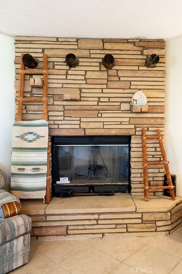 6425 Indian Cove Rd Unit 29, Palms, CA 92277 - detailed view of a stone fireplace and a textured ceiling