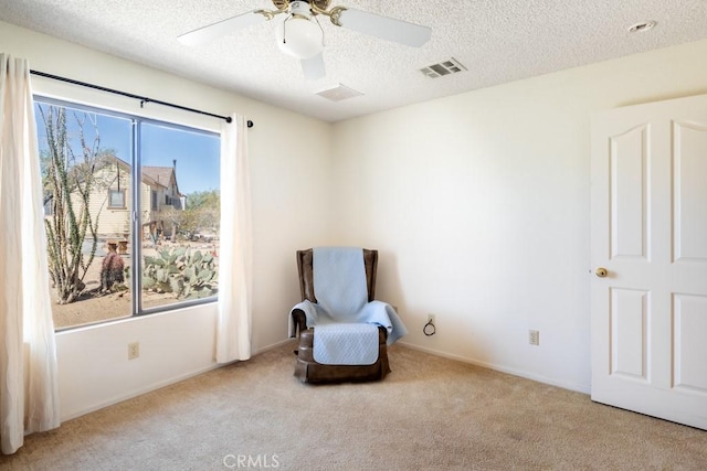 6425 Indian Cove Rd Unit 29, Palms, CA 92277 - unfurnished room with carpet flooring, healthy amount of natural light, a textured ceiling, and a ceiling fan