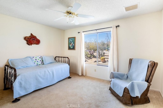 6425 Indian Cove Rd Unit 29, Palms, CA 92277 - carpeted bedroom featuring ceiling fan, a textured ceiling, and baseboards