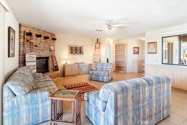 6425 Indian Cove Rd Unit 29, Palms, CA 92277 - living room featuring ceiling fan, a textured ceiling, and light tile patterned floors