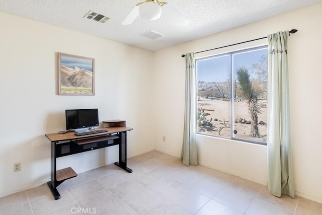 6425 Indian Cove Rd Unit 29, Palms, CA 92277 - home office with a textured ceiling, a ceiling fan, and light tile patterned floors