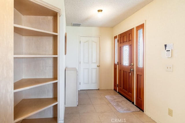 6425 Indian Cove Rd Unit 29, Palms, CA 92277 - tiled foyer entrance with a textured ceiling