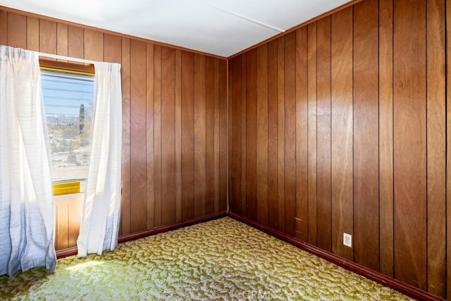 6425 Indian Cove Rd Unit 29, Palms, CA 92277 - carpeted spare room featuring wood walls
