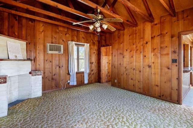 6425 Indian Cove Rd Unit 29, Palms, CA 92277 - empty room with beamed ceiling, carpet floors, wood walls, a ceiling fan, and a wall unit AC