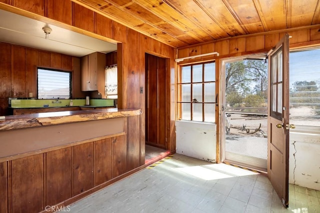 6425 Indian Cove Rd Unit 29, Palms, CA 92277 - kitchen featuring wood walls, plenty of natural light, and wooden ceiling
