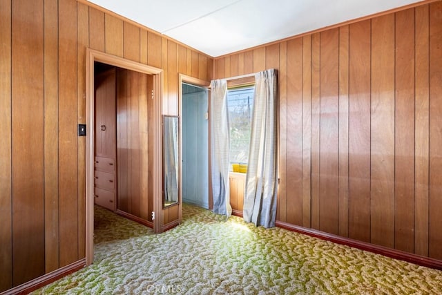 6425 Indian Cove Rd Unit 29, Palms, CA 92277 - spare room featuring carpet flooring and wooden walls