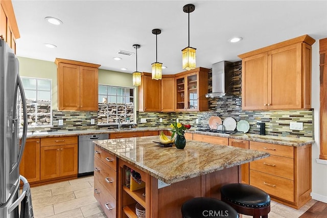 386 Los Altos Ave, Long Beach, CA 90814 - kitchen with stainless steel appliances, wall chimney range hood, backsplash, a center island, and recessed lighting