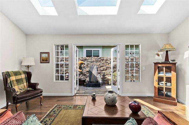 386 Los Altos Ave, Long Beach, CA 90814 - living room with a skylight, wood finished floors, and a wood stove