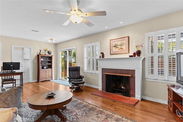 386 Los Altos Ave, Long Beach, CA 90814 - living area with wood finished floors, a ceiling fan, baseboards, a brick fireplace, and recessed lighting