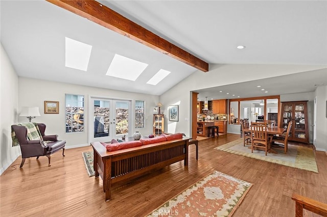 386 Los Altos Ave, Long Beach, CA 90814 - living room featuring a skylight, light wood-type flooring, recessed lighting, plenty of natural light, and baseboards