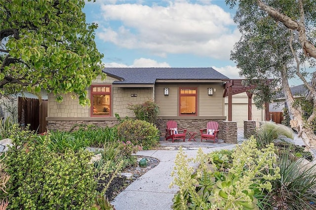 386 Los Altos Ave, Long Beach, CA 90814 - view of front of house featuring stone siding, a garage, and a pergola