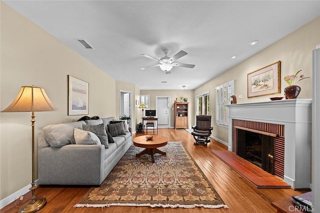 386 Los Altos Ave, Long Beach, CA 90814 - living area featuring wood finished floors, a brick fireplace, and a ceiling fan