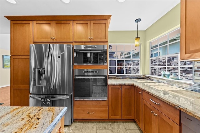 386 Los Altos Ave, Long Beach, CA 90814 - kitchen with stainless steel fridge with ice dispenser, double oven, and brown cabinetry