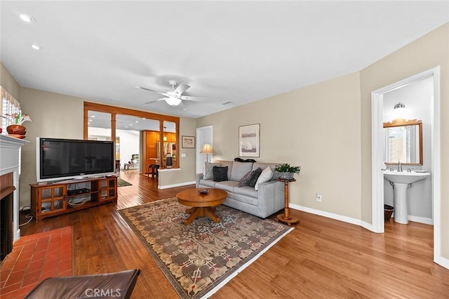 386 Los Altos Ave, Long Beach, CA 90814 - living area with wood finished floors, a fireplace with flush hearth, a ceiling fan, and recessed lighting
