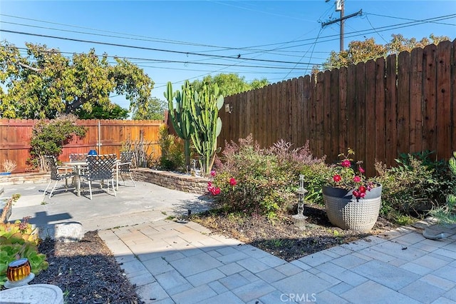 386 Los Altos Ave, Long Beach, CA 90814 - fenced backyard featuring a patio area and outdoor dining area