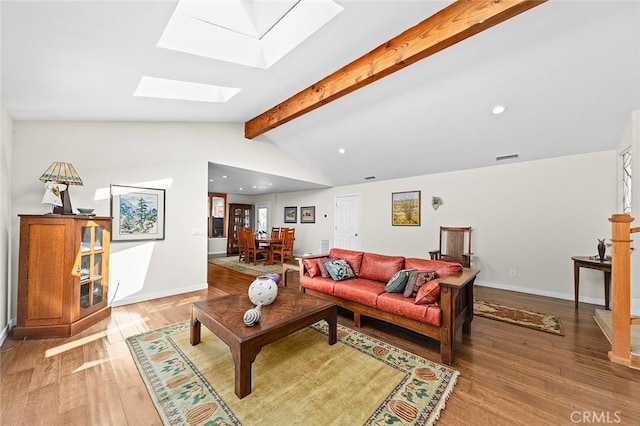 386 Los Altos Ave, Long Beach, CA 90814 - living room featuring a skylight, light wood-style floors, recessed lighting, and baseboards