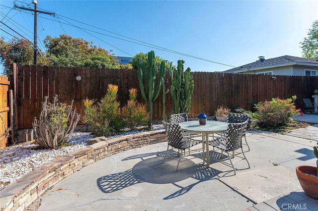 386 Los Altos Ave, Long Beach, CA 90814 - fenced backyard featuring outdoor dining space and a patio