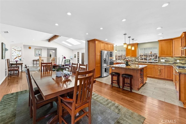386 Los Altos Ave, Long Beach, CA 90814 - dining space featuring light wood-type flooring, recessed lighting, healthy amount of natural light, and a skylight
