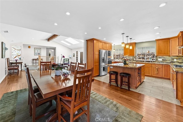 386 Los Altos Ave, Long Beach, CA 90814 - dining space featuring light wood-type flooring, recessed lighting, plenty of natural light, and a skylight