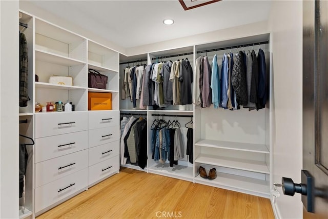 walk in closet featuring light wood finished floors