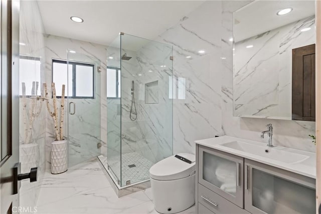 full bathroom with tile walls, toilet, marble tiled flooring, a marble finish shower, and vanity