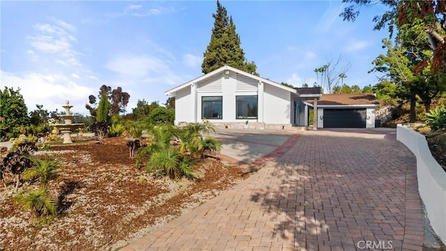 ranch-style house featuring a garage
