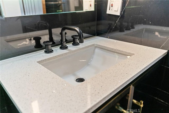 detailed view of a sink and decorative backsplash