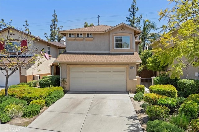 1534 Rowan Gln, Escondido, CA 92025 - view of front of property featuring stucco siding, driveway, an attached garage, and a shingled roof