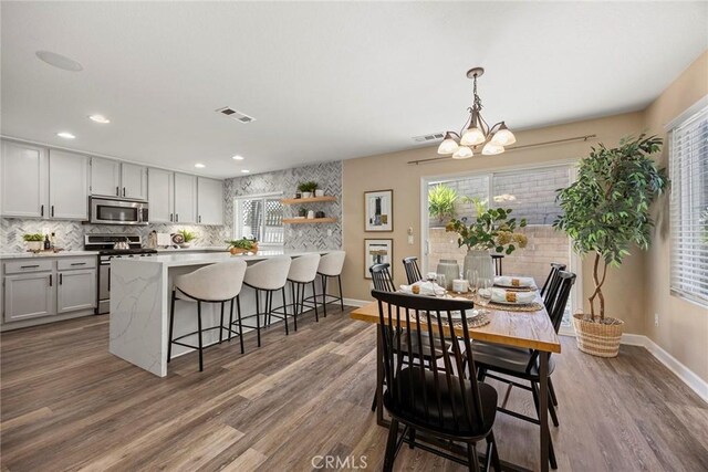 1534 Rowan Gln, Escondido, CA 92025 - dining area with wood finished floors, a chandelier, plenty of natural light, and recessed lighting