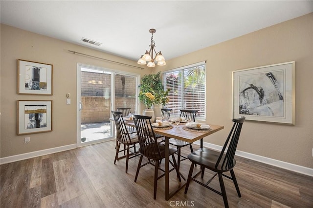 1534 Rowan Gln, Escondido, CA 92025 - dining area featuring a chandelier and wood finished floors
