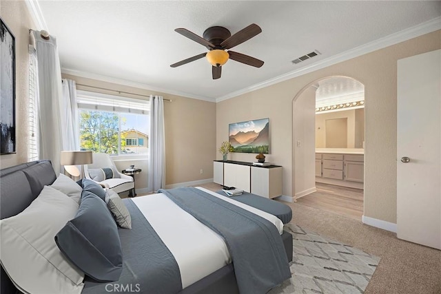 1534 Rowan Gln, Escondido, CA 92025 - bedroom with crown molding, light colored carpet, ensuite bathroom, arched walkways, and a ceiling fan