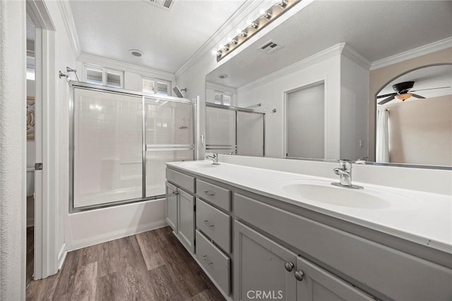 1534 Rowan Gln, Escondido, CA 92025 - full bath featuring ornamental molding, double vanity, ceiling fan, wood finished floors, and enclosed tub / shower combo