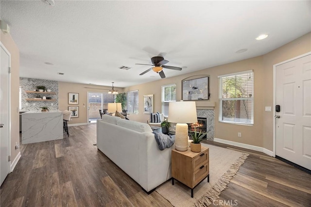 1534 Rowan Gln, Escondido, CA 92025 - living room with a glass covered fireplace, wood finished floors, and a ceiling fan