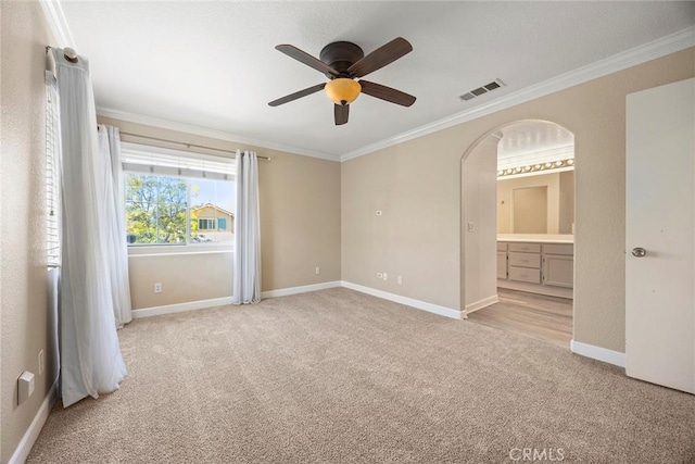 1534 Rowan Gln, Escondido, CA 92025 - unfurnished bedroom with light carpet, ornamental molding, arched walkways, ensuite bath, and a ceiling fan