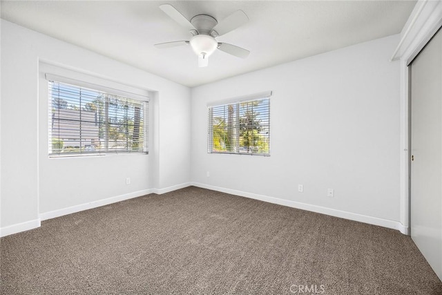 1534 Rowan Gln, Escondido, CA 92025 - unfurnished bedroom with dark carpet, a closet, and ceiling fan