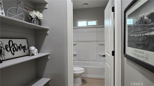 6485 Providence Ct, Magalia, CA 95954 - bathroom featuring toilet, wood finished floors, and bathtub / shower combination
